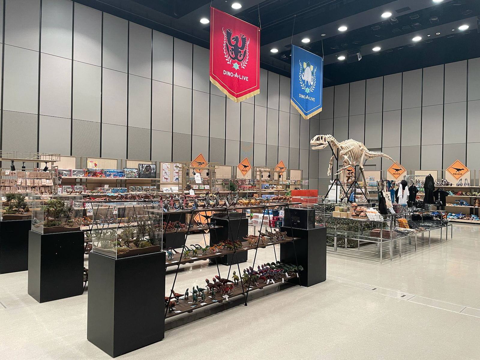 Browse a selection of exclusive dinosaur merchandise and collectibles from Japan available for purchase at the DINOSAUR ODYSSEY Activation Area.