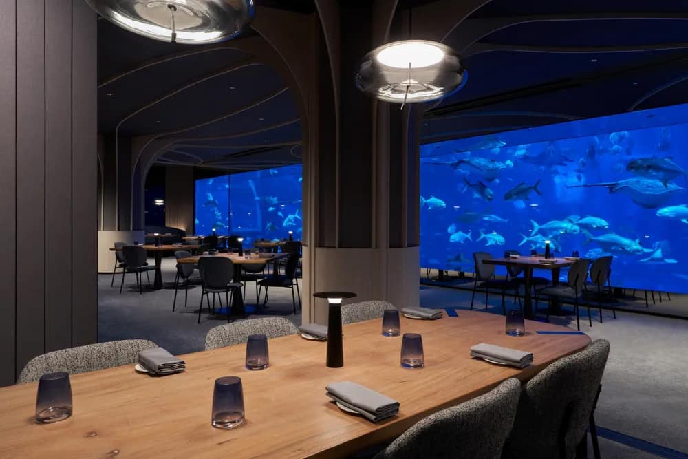 Dining room with a view of the aquarium at Ocean Restaurant
