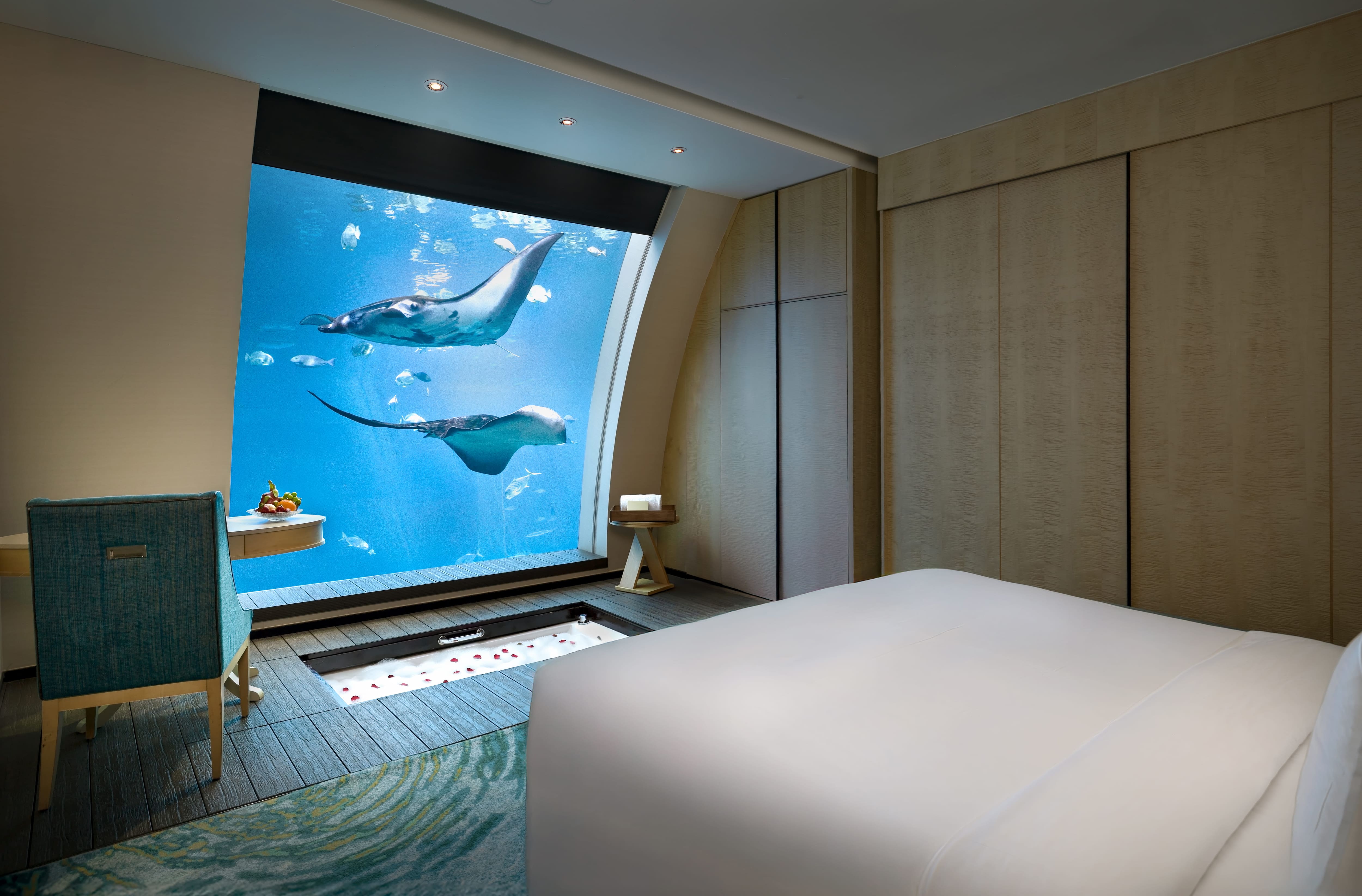 Equarius Ocean Suites offer an underwater bedroom view within a two-storey suite. There are just 11 suites, each measuring 93 sqm. The lower-level viewing window looks into a marine habitat home to more than 40,000 marine animals; the animals visible at any moment vary.