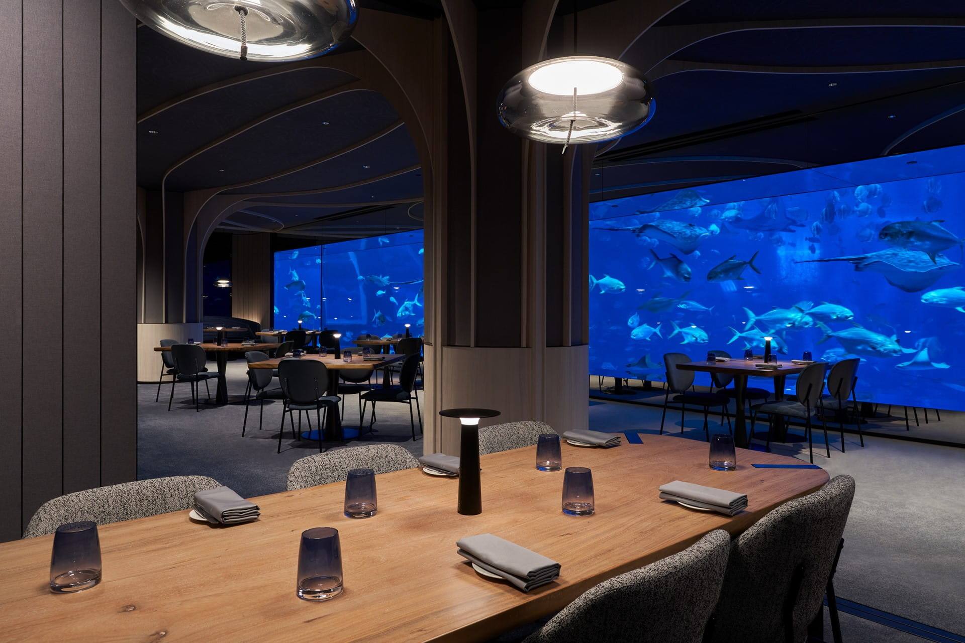 Dining room with a view of the aquarium at Ocean Restaurant