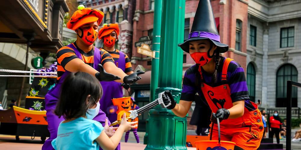 Candy Ambassadors handing out Halloween candy at USS